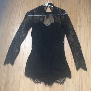 Black one piece open back romper